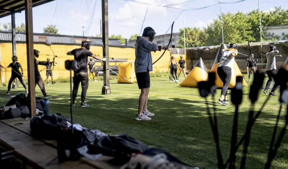 Small team playing combat archery at venue