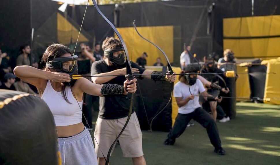 Group playing combat archery at party venue