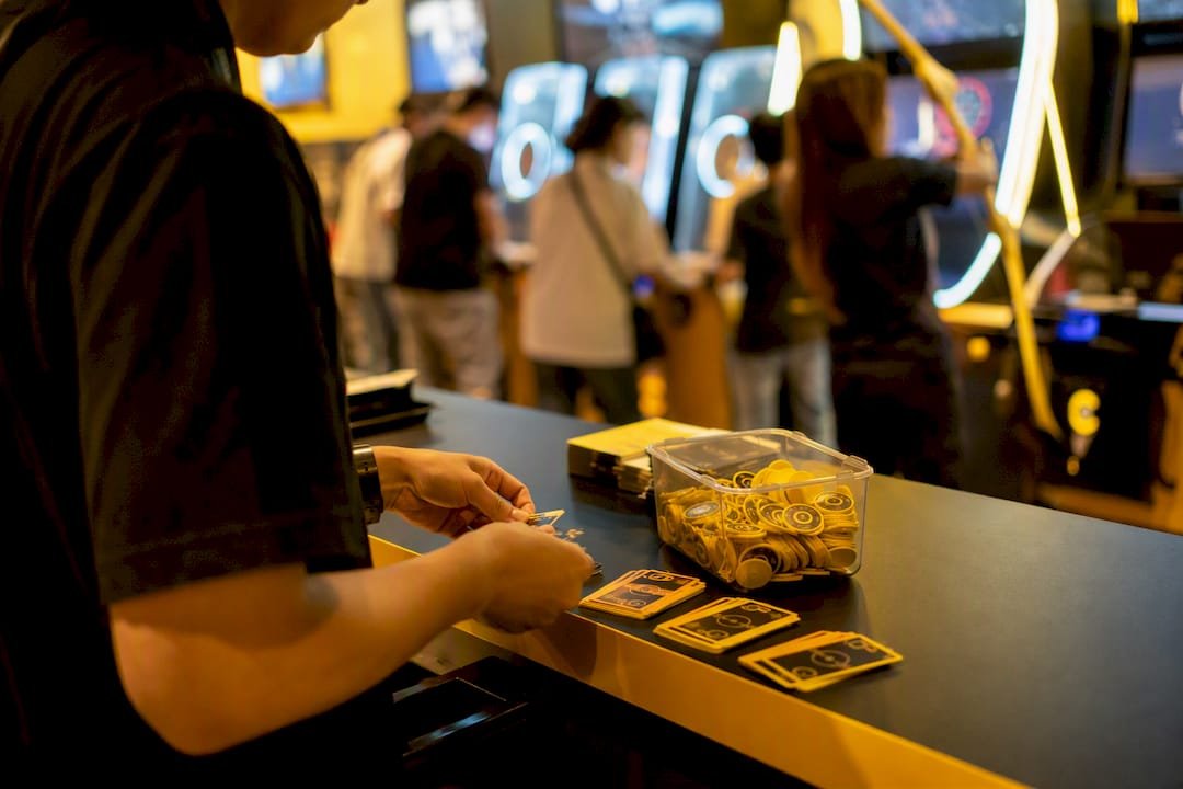 Arcade host managing game credits at party