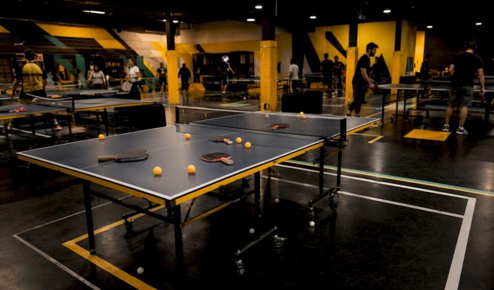 Ping pong table with paddles and balls ready