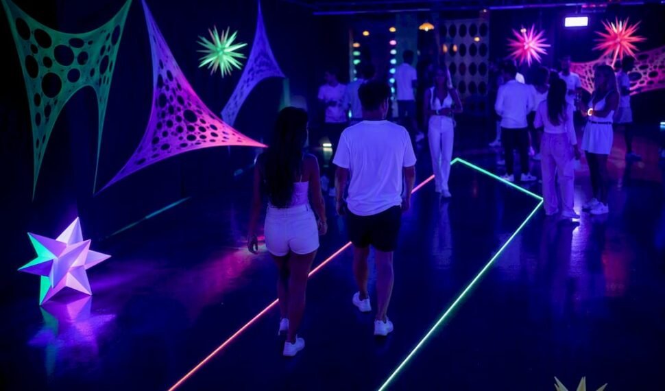 Guests enjoying an evenly lit glow party