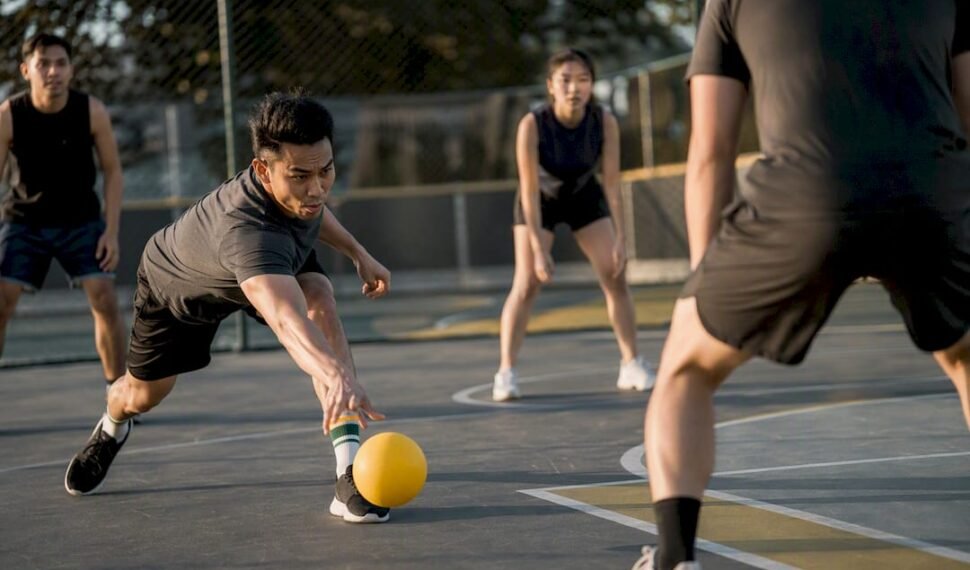 Dodgeball players practicing safe low throws