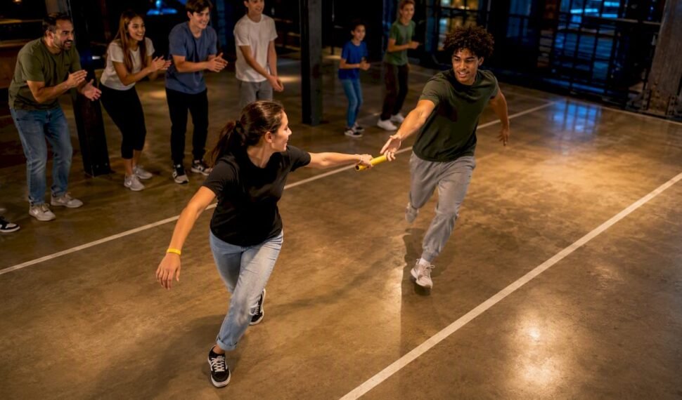 Youth group competing in indoor team relay