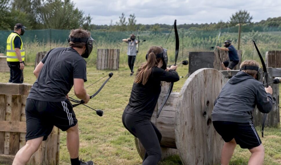 Teams playing combat archery outdoors