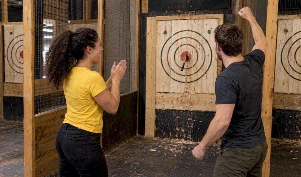 Couple celebrating an axe throw together