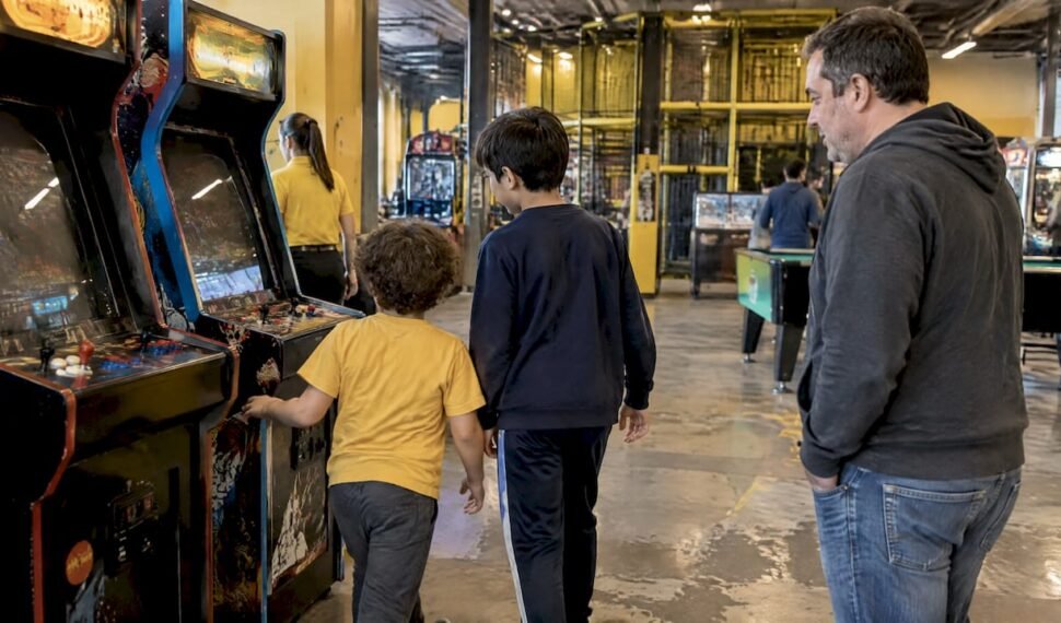 Family moving from arcade game to activities