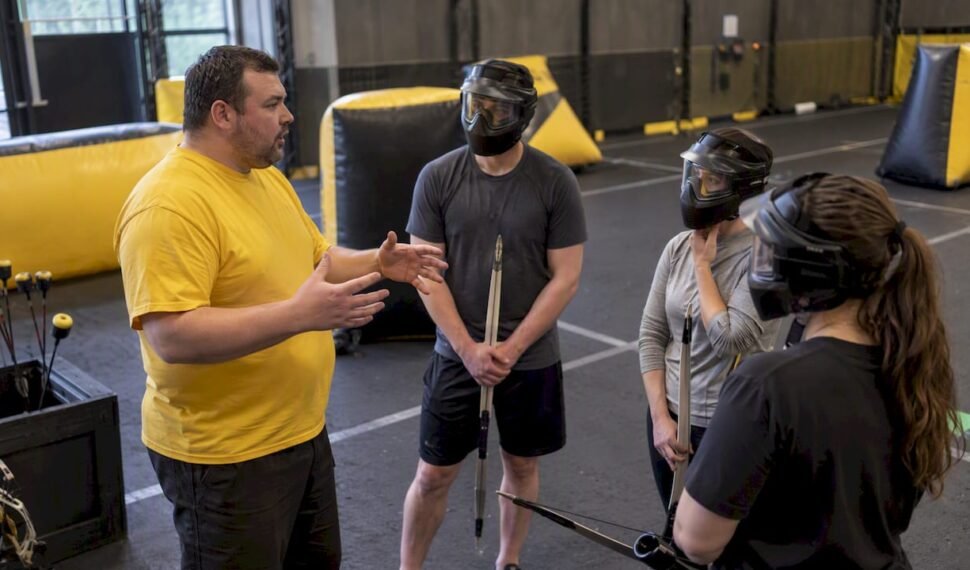 Instructor briefing players before combat archery