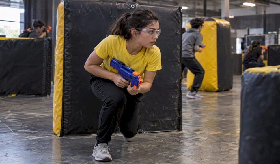 Player crouches in practical Nerf battle clothing