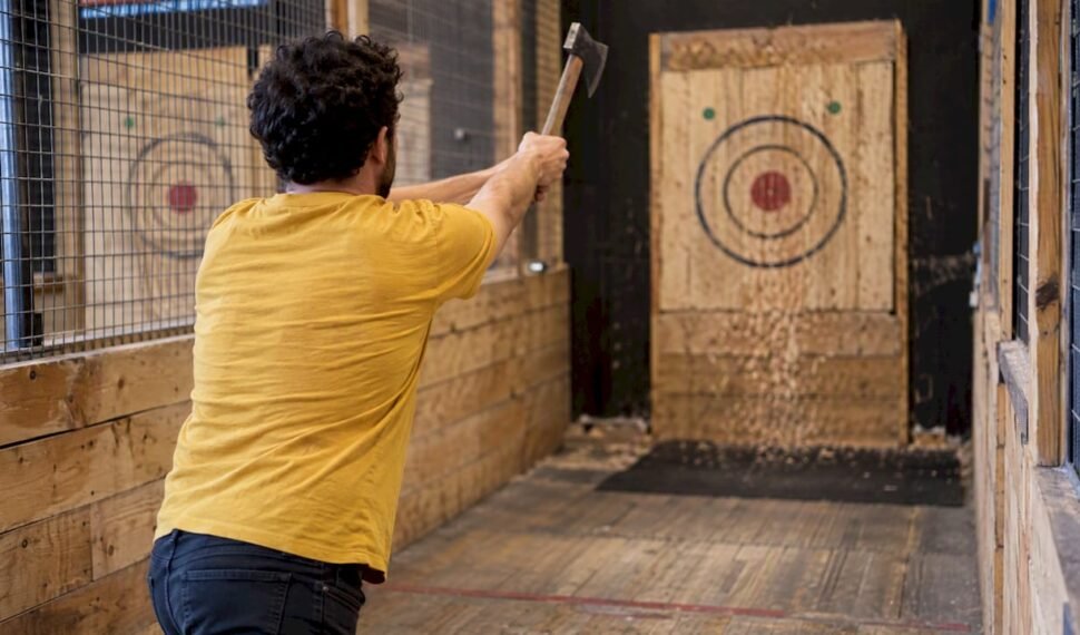 Thrower practicing a two-handed axe release