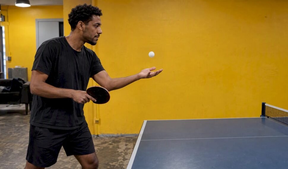 Player tossing a ball for a legal serve