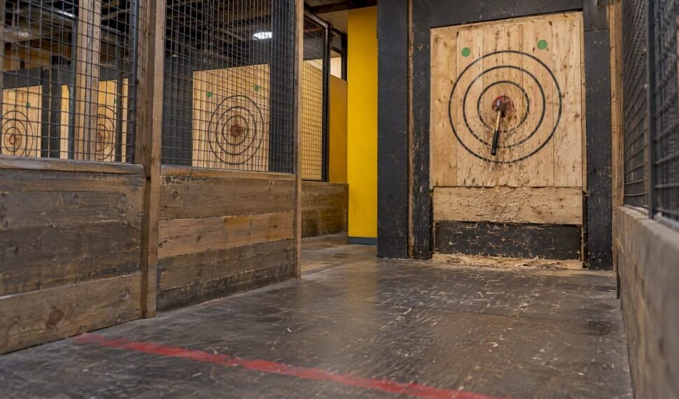 Axe lodged in a wooden throwing target